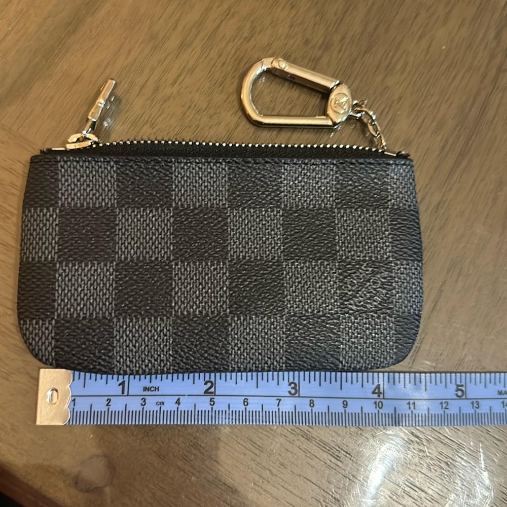 Checkered black and light gray small pouch
